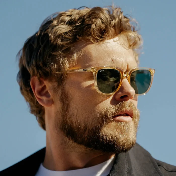 Champagne Crystal / G15 || Square prescription sunglasses with champagne crystal acetate frame, keyhole bridge, and green lenses worn by man outdoors