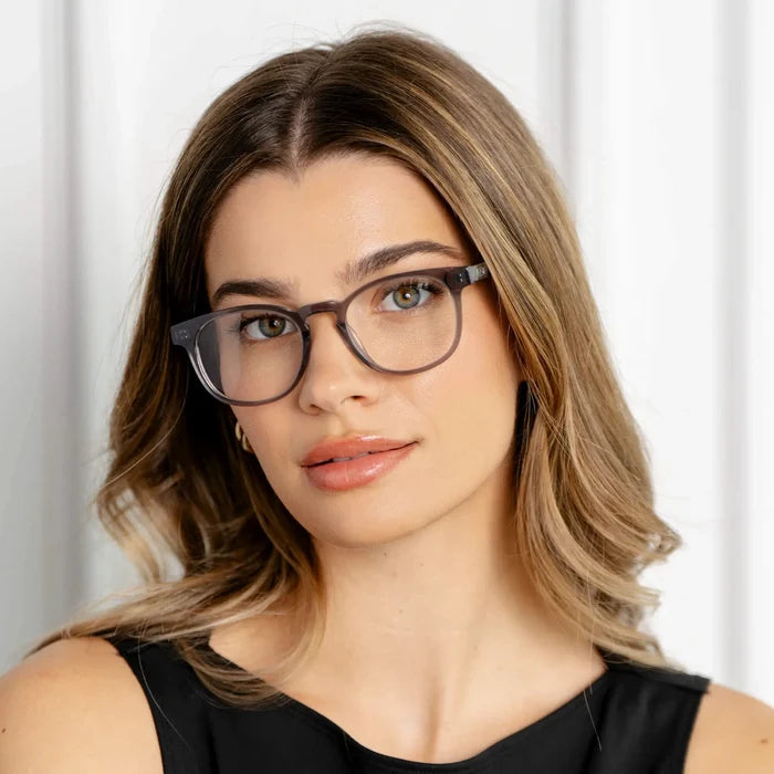 Crystal Grey || Modern round prescription glasses with grey acetate frame and clear lens worn by woman indoors
