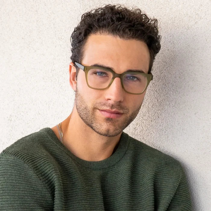 Frosted Khaki Green || Rectangular prescription glasses with matte green frame and subtle metal detailing on temples worn by man in natural light