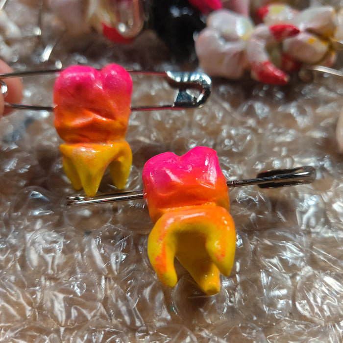 Neon pink and yellow w safety pin