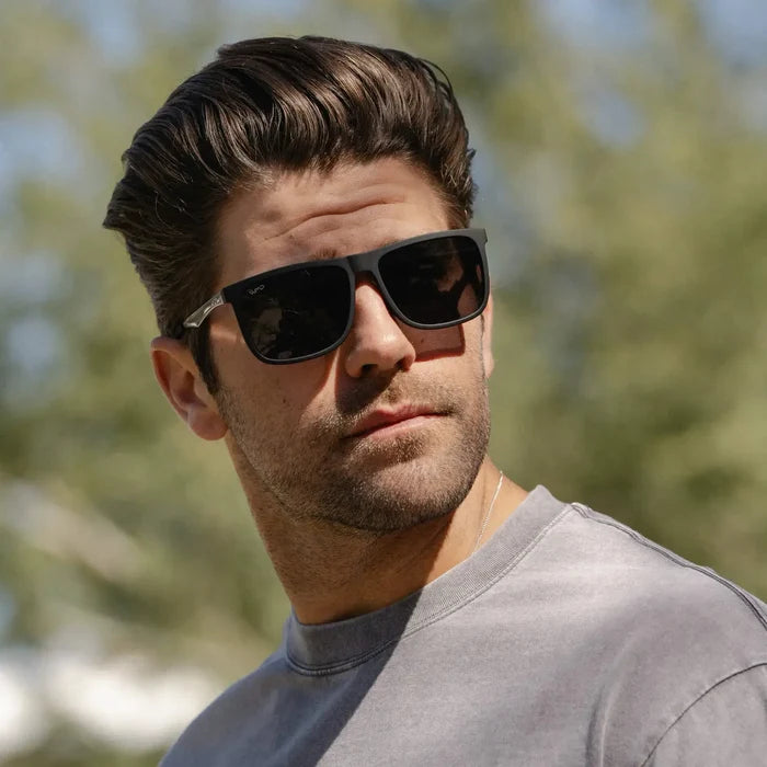 Jade Black / Grey || Square prescription sunglasses with jade black acetate frame and grey lenses worn by man outdoors