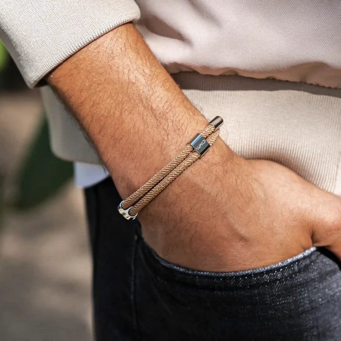 Desert Tan / Silver || Knox & Kent beige rope bracelet with polished silver clasp worn on wrist over casual light sweater sleeve