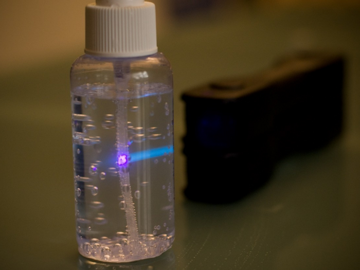Green Laser Blox projecting a beam for safe classroom optics experiments