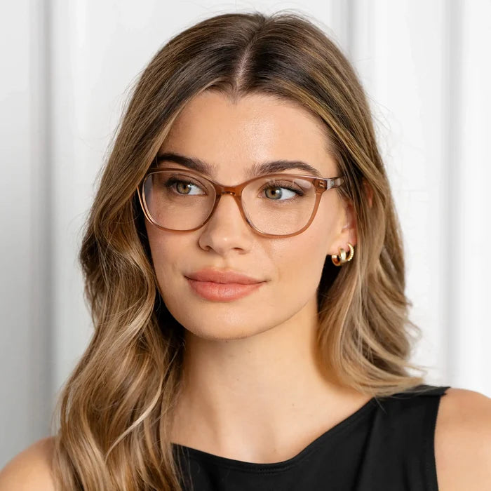 Light Brown || Square prescription eyeglasses with light brown acetate frame and subtle cat-eye corners worn by woman indoors in natural light