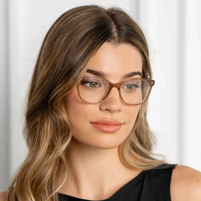 Light Brown || Square prescription eyeglasses with light brown acetate frame and subtle cat-eye corners worn by woman indoors in natural light