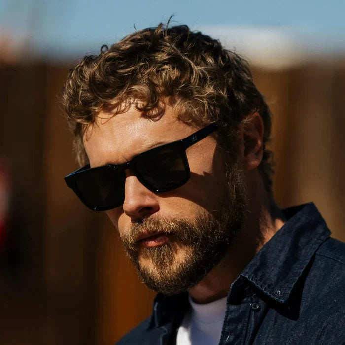 Black / Grey || Model wearing Men's Sleek Square Prescription Sunglasses with Black Acetate Frame and Grey Prescription Lens