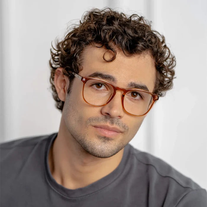 Crystal Brown || Square prescription glasses with crystal brown acetate frame and subtle keyhole bridge worn by man indoors