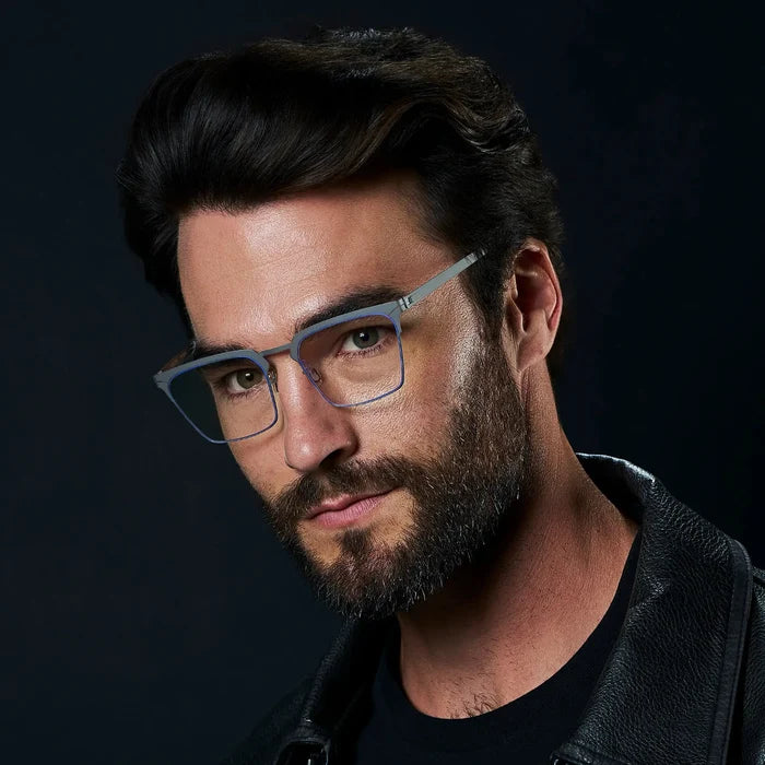 Matte Grey || Raven blue light glasses with a thin rim frame matte grey frame and rectangular clear lenses worn by man