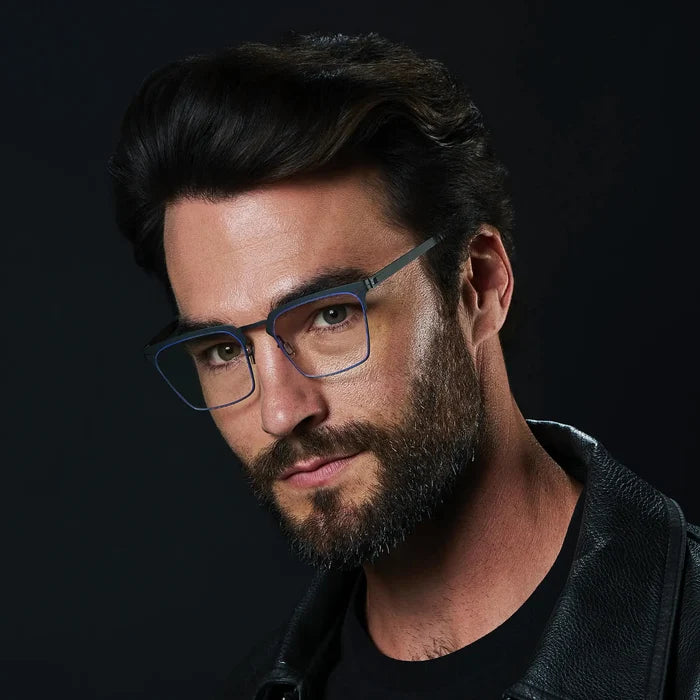 Matte Black || Raven blue light glasses with slim matte black metal frame and square lenses worn by man with beard and dark hair