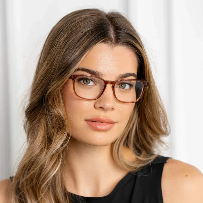 Redbrick Brown || Women's brown translucent rectangular blue light glasses with clear lenses and natural makeup on light background