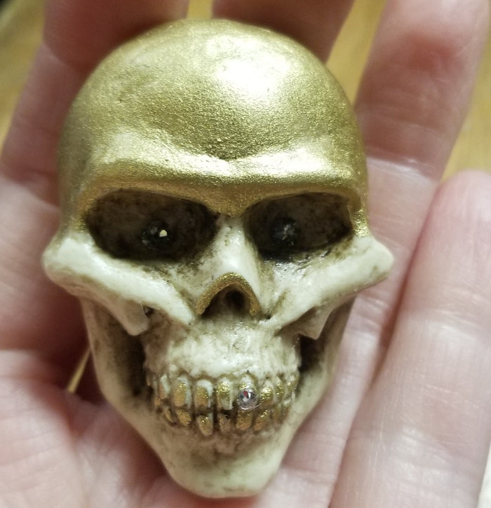 Bone and Gold with Jeweled Eyes and Tooth