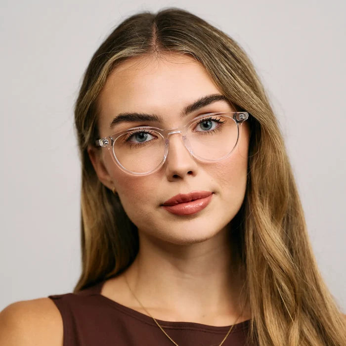 Clear || Female Model wearing Women's Round Blue Light Blocking Glasses with a Clear Acetate Frame and Clear Lens
