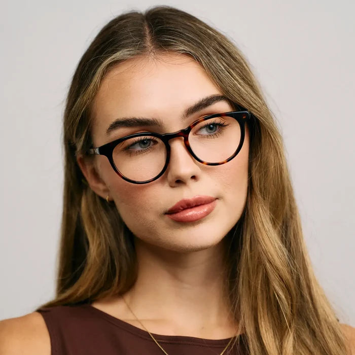 Brown Tortoise || Model wearing Women's Round Prescription Glasses with a Brown Tortoise Acetate Frame and Clear Lens