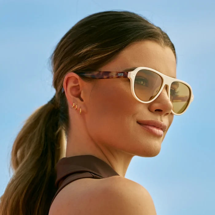 Ivory Tortoise / Yellow Tinted Lens || Woman wearing Rounded Aviator Sunglasses with Ivory Tortoise Frame and Yellow Tinted Lenses outdoors