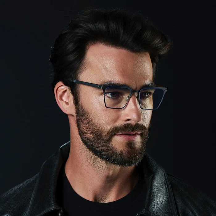 Matte Black || Zev blue light glasses with slim black metal frames and rectangular clear lenses worn by bearded man